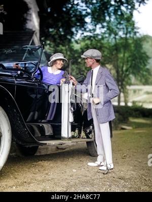 1920s COUPLE WOMAN MAN RESTING GOLF CLUB BAG ON 1922 LINCOLN CONVERTIBLE RUNNING BOARD UPSCALE COUNTRY CLUB GOLFING LIFESTYLE - m130c HAR001 HARS BEAUTY SUBURBAN COLOR GOLFER OLD TIME BUSY NOSTALGIA LINCOLN OLD FASHION AUTO FITNESS STYLE VEHICLE SAFETY TEAMWORK ATHLETE FIT PLEASED JOY LIFESTYLE SATISFACTION FEMALES HUSBANDS HEALTHINESS TRANSPORT COPY SPACE FRIENDSHIP FULL-LENGTH LADIES PERSONS INSPIRATION AUTOMOBILE MALES GOLFING CONFIDENCE TRANSPORTATION RESTING CLUBS GOALS SUCCESS HAPPINESS ADVENTURE LEISURE STYLES MOTOR VEHICLE AUTOS EXCITEMENT RECREATION PRIDE OPPORTUNITY MOTORING SMILES Stock Photo