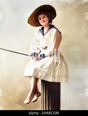 1900s 1910s WOMAN WEARING DRESS WITH SAILOR STYLE COLLAR STRAW HAT LOOKING AT CAMERA SITTING ON DOCK PILING WITH FISHING ROD - o2771c HAR001 HARS OLD FASHION 1 FACIAL STYLE POLE ATHLETE PLEASED JOY LIFESTYLE SAILOR FEMALES STUDIO SHOT GROWNUP HEALTHINESS COPY SPACE FULL-LENGTH LADIES PERSONS GROWN-UP ATHLETIC ROD TACKLE EXPRESSIONS ANGLER LINEN EYE CONTACT POLES HAPPINESS FISHING POLE FISHING TACKLE CHEERFUL HOBBY LEISURE HOBBIES RECREATION BAREFOOT SMILES JOYFUL ANGLING FISHING ROD PLEASANT PEOPLE ADULTS YOUNG ADULT WOMAN CAUCASIAN ETHNICITY HAR001 OLD FASHIONED Stock Photo