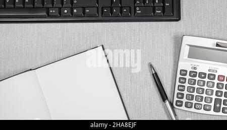Book opened on a workspace. White pages for inscriptions. Stock Photo