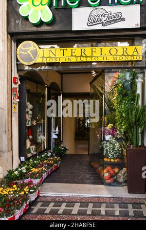 Entrance of a flower shop affiliated with the delivery network Interflora in the centre of Genoa, Liguria, Italy Stock Photo