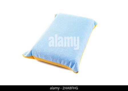 The new blue and yellow sponge for washing glass and dishes, isolated on a white background. Stock Photo