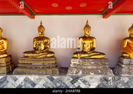 Gilt statues of the Buddha in temple in Bangkok, Thailand Stock Photo