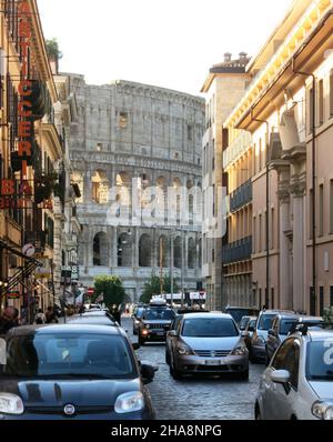 The Colosseum in Rome, Italy Viewed from a Busy Side Street. Stock Photo