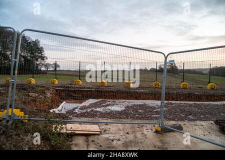 Aylesbury Vale, Buckinghamshire, UK. 8th December, 2021. Part of an HS2 haul road. The High Speed Rail construction from London to Birmingham is having a very adverse impact upon part of the Chilterns which is an Area of Outstanding Natural Beauty. The Eastern Leg of HS2 has now been cancelled as the project is hugely over budget. Credit: Maureen McLean/Alamy Stock Photo