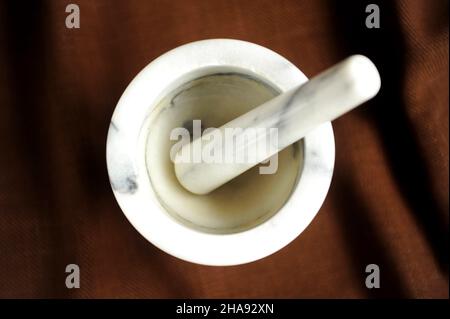 Old marble  mortar close up photo on dark background Stock Photo