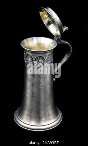 An old silver beer mug with a lid Stock Photo