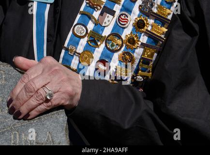 A member of the Daughters of the American Revolution wears her DAR pins, ribbons and sash at a commemorative event in Santa Fe, New Mexico. Stock Photo