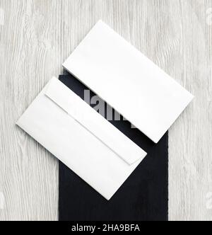 Two blank envelopes. Front and back side. Template for branding identity. Top view. Flat lay. Stock Photo