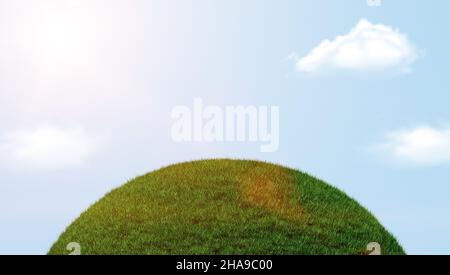 Part of a spherical green grass and clouds in the blue sky Stock Photo