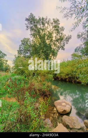 Sunset view of the Jordan River with eucalyptus trees and clouds. Northern Israel Stock Photo