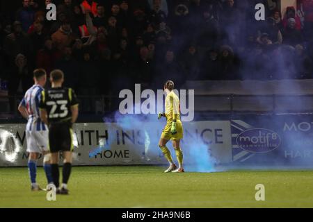 HARTLEPOOL, GBR. DEC 11TH Ben Killip of Hartlepool United deals with a smoke bomb during the Sky Bet League 2 match between Hartlepool United and Scunthorpe United at Victoria Park, Hartlepool on Saturday 11th December 2021. (Credit: Mark Fletcher | MI News) Credit: MI News & Sport /Alamy Live News Stock Photo