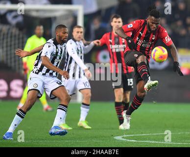 Udine, Italy. 11th Dec, 2021. AC Milan's Frank Kessie (R) vies with Udinese's Beto during a Serie A soccer match between Udinese and AC Milan in Udine, Italy, Dec. 11, 2021. Credit: Str/Xinhua/Alamy Live News Stock Photo
