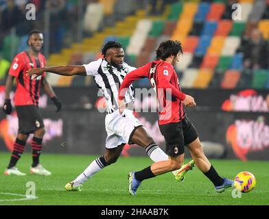 Udine, Italy. 11th Dec, 2021. AC Milan's Sandro Tonali (R) vies with Udinese's Isaac Success during a Serie A soccer match between Udinese and AC Milan in Udine, Italy, Dec. 11, 2021. Credit: Str/Xinhua/Alamy Live News Stock Photo