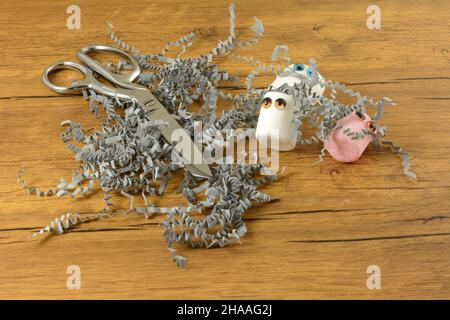 Food crafting with white jumbo and strawberry pink marshmallows and shredded crinkled gray paper Stock Photo