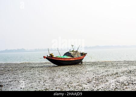 Close-up of native wooden fishing boat has been anchored on beach Stock Photo