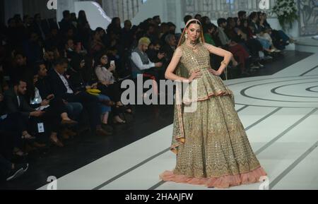 Pakistani model presents a creation by a brand Fatima Salamat