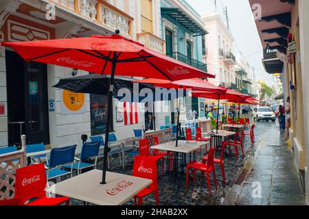 red umbrellas of a restaurant in the center of san juan, puerto rico - dec, 2021. High quality photo Stock Photo