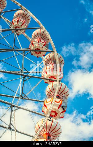 Colorful ferris wheel over blue sky. Stock Photo