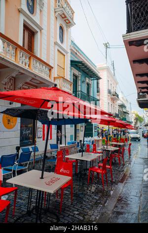 red umbrellas of a restaurant in the center of san juan, puerto rico - dec, 2021. High quality photo Stock Photo