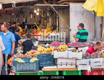 Amman, Jordan - 09.02.2021: Fresh fruit market in Amman, Jorda. Outdoor market with tropical fruits on display Stock Photo