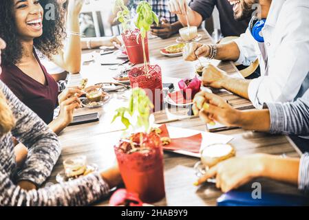 Friends group drinking cappuccino at coffee bar restaurant - People talking and having fun together at fashion cafeteria - Friendship concept Stock Photo