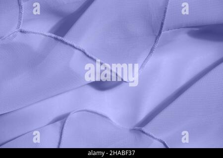 Abstract background of soft folds in the trendy color Very Peri Stock Photo