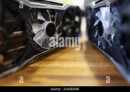 Computer processors placed on wooden surface in front of each other Stock Photo