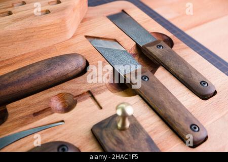 Tanner tools. Handmade Skiving knife and awl Stock Photo - Alamy