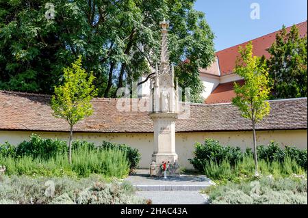 Statue of Saint Mary with infant Jesus in Szombathely, Hungary in front of the Saint Martin Church Stock Photo