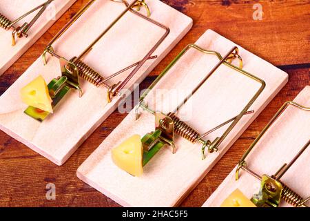 Four mousetraps baited with cheese, Mice infestation concept Stock Photo