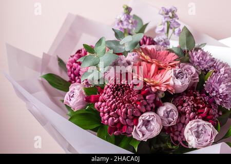 Beautiful bouquet of mixed flowers on color background Stock Photo