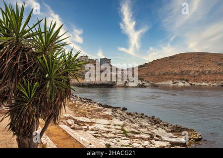 Landscape with a rocky beach close to Saranda, Albania. Saranda is located on an open sea gulf of the Ionian Sea within the Mediterranean Sea. Stock Photo