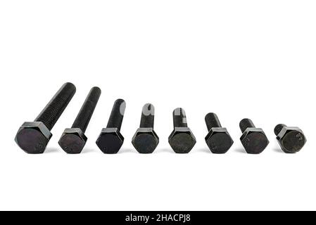 Background made of black screws with a hardness of 4.8, isolated on a white background, visible small and large screws. Stock Photo