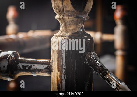Renovation of old furniture. Home improvement concept with painting wooden surface. Stock Photo