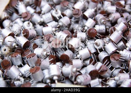 vintage electronic components for utilization. many same details in aluminium case. texture for background. Stock Photo
