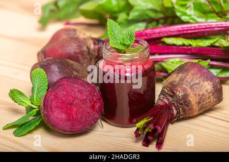 Beetroot juice in a mason jar mug on grey stone background. Detox and healthy diet Stock Photo