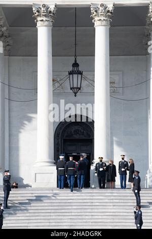 Washington, United States of America. 09 December, 2021. U.S. Chairman of the Joint Chiefs Gen. Mark Milley and former Senator Elizabeth Dole render honors as Armed Forces honor guard carry the flag-draped casket of World War II veteran and former Senator Robert Dole up the steps of the U.S. Capitol where it will lay in state, December 9, 2021 in Washington, D.C. Senator Dole died at age 98 following a lifetime of service to the nation.  Credit: Sgt. Kevin Roy/U.S. Army/Alamy Live News Stock Photo