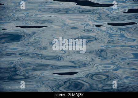 Deep blue colored sea water, in Mali Losinj, Croatia. Blue color sea water background.Water surface texture of deep blue sea. Soft waves, ripple water Stock Photo