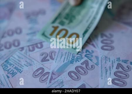 Economic crisis in Turkey. 100 dollars and Turkish liras on the background. Selective focus. Stock Photo