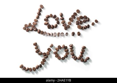 coffee bean lettering close-up top view on white background. brown arabica coffee beans Stock Photo
