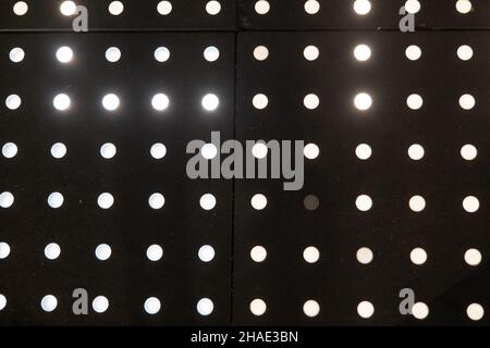Abstract bright white led lights spots on the outdoor sidewalk, high contrast background. Stock Photo
