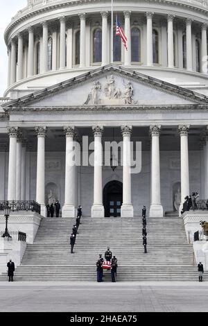 Washington, United States Of America. 10th Dec, 2021. Washington, United States of America. 10 December, 2021. An Armed Forces honor guard carry the flag-draped casket of World War II veteran and former Senator Robert Dole down the steps of the U.S. Capitol, December 10, 2021 in Washington, DC Senator Dole died at age 98 following a lifetime of service to the nation. Credit: Leroy Council/U.S. Army/Alamy Live News Stock Photo