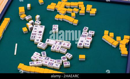 Many Mahjong tiles on on the playing field. An ancient asian game called Mahjong as a way to spend your free time with joy and get some fun. Mahjong t Stock Photo