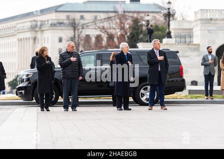 Washington, United States Of America. 10th Dec, 2021. Washington, United States of America. 10 December, 2021. Senate Majority Leader Chuck Schumer, House Speaker Nancy Pelosi, Senate Minority Leader Mitch McConnell and House Minority Leader Kevin McCarthy, salute as an Armed Forces honor guard carry the remains of World War II veteran and former Senator Robert Dole on departure from the U.S. Capitol, December 10, 2021 in Washington, DC Senator Dole died at age 98 following a lifetime of service to the nation. Credit: Sgt. Zachery Perkins/U.S. Army/Alamy Live News Stock Photo