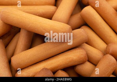 Bread sticks close up. Background from snacks in the form of sticks. Grissini Stock Photo