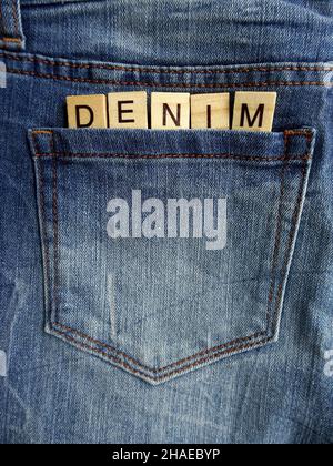 Word DENIM in jeans pocket, denim jeans, sale concept Stock Photo