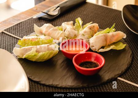 Vietnamese rolls with vegetables, served on restaurant Stock Photo