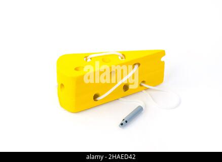 Children's educational toy for the development of motor skills in the form of cheese and a mouse on a white background. Stock Photo