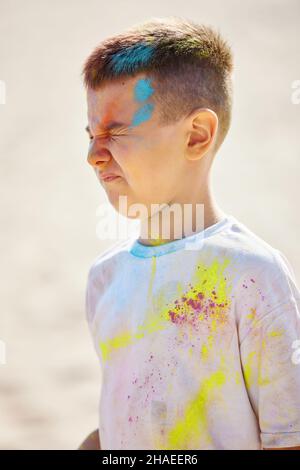 Portrait of happy little child girl in holly paints Stock Photo