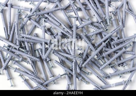 Dowel-nails in bulk on a white background Stock Photo